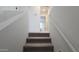 Carpeted staircase with white walls leading to the upper level of the home at 37609 N Cowboy Ln, San Tan Valley, AZ 85140