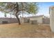 Backyard featuring a storage shed, bbq, mature tree and a block wall at 1325 E Monte Vista E Rd, Phoenix, AZ 85006