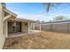 Backyard with a covered patio, block wall, and low-maintenance landscaping at 1325 E Monte Vista E Rd, Phoenix, AZ 85006