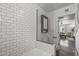 Updated bathroom features a subway tiled tub with glass partition at 1325 E Monte Vista E Rd, Phoenix, AZ 85006