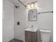 Updated bathroom with white subway tile shower, black fixtures, and modern vanity at 1325 E Monte Vista E Rd, Phoenix, AZ 85006