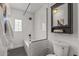 Updated bathroom features a subway tiled tub with glass partition at 1325 E Monte Vista E Rd, Phoenix, AZ 85006