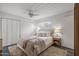 Bright bedroom with a cozy rug, ceiling fan, and ample closet space at 1325 E Monte Vista E Rd, Phoenix, AZ 85006