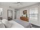 Bright bedroom with a dresser, ceiling fan, and view into the hallway at 1325 E Monte Vista E Rd, Phoenix, AZ 85006