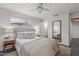 Light-filled bedroom with a ceiling fan and view into the hallway at 1325 E Monte Vista E Rd, Phoenix, AZ 85006