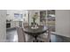Inviting dining area with a round table, stylish chairs, and natural light from the sliding doors at 1325 E Monte Vista E Rd, Phoenix, AZ 85006
