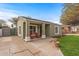 Charming single-story home with a cozy front porch and a well-manicured lawn at 1325 E Monte Vista E Rd, Phoenix, AZ 85006