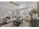 Comfortable living room with natural light, a ceiling fan, and neutral-toned furnishings at 1325 E Monte Vista E Rd, Phoenix, AZ 85006