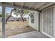 View from the covered patio into the backyard, showing the shed, block wall and bench at 1325 E Monte Vista E Rd, Phoenix, AZ 85006