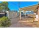 Well-kept backyard featuring a covered patio, versatile storage shed, and attractive stone accents at 1820 N 7Th Ave, Phoenix, AZ 85007