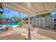 Charming backyard showcasing a covered patio, sparkling pool, and well-maintained landscaping at 1820 N 7Th Ave, Phoenix, AZ 85007