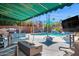 Backyard featuring a covered patio, outdoor seating, pool, and a barbeque area for entertaining at 1820 N 7Th Ave, Phoenix, AZ 85007