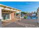 Inviting backyard with a covered patio, refreshing pool, and lush greenery for outdoor enjoyment at 1820 N 7Th Ave, Phoenix, AZ 85007
