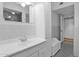 Bathroom featuring white vanity, cabinets, tiled backsplash, and black and white tiled floor at 1820 N 7Th Ave, Phoenix, AZ 85007