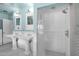 Bright bathroom featuring a tiled shower and dual pedestal sinks with vintage style fixtures at 1820 N 7Th Ave, Phoenix, AZ 85007