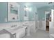 Bathroom with double sinks, decorative mirrors, and tile flooring at 1820 N 7Th Ave, Phoenix, AZ 85007