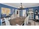 Dining room featuring a large wooden table and coastal decor at 1820 N 7Th Ave, Phoenix, AZ 85007