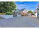 A long, gated driveway provides ample parking space and backyard access to the charming brick home at 1820 N 7Th Ave, Phoenix, AZ 85007