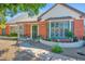Charming brick home featuring a bay window, wrought iron gate, and well-manicured landscaping enhancing its curb appeal at 1820 N 7Th Ave, Phoenix, AZ 85007