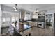 Modern kitchen features stainless steel appliances, dark countertops, and a rustic island, creating a chef's dream space at 1820 N 7Th Ave, Phoenix, AZ 85007