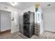 Charming laundry room with front load washer and dryer and modern flooring at 1820 N 7Th Ave, Phoenix, AZ 85007
