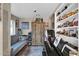 Eclectic living room featuring a piano, decorative shelves, and comfortable seating at 1820 N 7Th Ave, Phoenix, AZ 85007