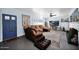 Spacious living room featuring comfortable seating, a large TV, and an eclectic mix of decor for a cozy atmosphere at 1820 N 7Th Ave, Phoenix, AZ 85007