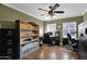 Spacious office with a ceiling fan, hardwood floors, shelving unit, and two work spaces at 1820 N 7Th Ave, Phoenix, AZ 85007