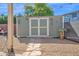 A charming storage shed with double doors in the backyard at 1820 N 7Th Ave, Phoenix, AZ 85007