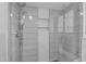 Modern tiled shower with glass door and shelving niches for toiletries and a rain shower head at 1820 N 7Th Ave, Phoenix, AZ 85007