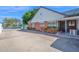 Charming brick home featuring a cozy, covered porch and mature landscaping adding to its curb appeal at 1820 N 7Th Ave, Phoenix, AZ 85007