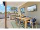 Outdoor dining area with a built-in grill and mounted television, perfect for entertaining at 3125 N 86Th Pl, Scottsdale, AZ 85251