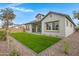 Backyard with desert landscaping, artificial grass and covered patio at 3624 N 59Th St, Mesa, AZ 85215