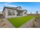 Backyard with artificial grass and low maintenance desert landscaping at 3624 N 59Th St, Mesa, AZ 85215