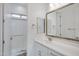 Stylish bathroom featuring double mirrors, a walk-in shower, and modern fixtures for a luxurious feel at 3624 N 59Th St, Mesa, AZ 85215