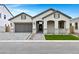 Charming single-story home with a two-car garage, arched entryway, and well-manicured front yard at 3624 N 59Th St, Mesa, AZ 85215