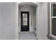 A welcoming front door with a glass insert, framed by white archways offering a glimpse inside at 3624 N 59Th St, Mesa, AZ 85215