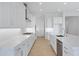 Modern kitchen with long countertops, stainless steel appliances, and a stylish island at 3624 N 59Th St, Mesa, AZ 85215