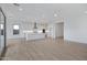 Bright open-concept kitchen with white cabinets, stainless steel appliances and large island at 3624 N 59Th St, Mesa, AZ 85215
