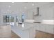 Bright kitchen with white cabinets, stainless steel appliances, and spacious center island with seating at 3624 N 59Th St, Mesa, AZ 85215