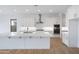 Modern kitchen featuring white cabinetry, a large island, and stainless steel appliances at 3624 N 59Th St, Mesa, AZ 85215