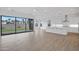 A bright, open living space with tile floors, a modern kitchen, and a large sliding glass door at 3624 N 59Th St, Mesa, AZ 85215