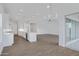 Bright, airy open-concept living area featuring tile floors, a modern kitchen, and seamless outdoor access at 3624 N 59Th St, Mesa, AZ 85215