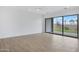 Bright, modern living room with tile flooring and view to backyard with desert landscaping at 3624 N 59Th St, Mesa, AZ 85215