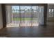 Bright living room featuring light tile floors and large sliding glass doors to the backyard at 3624 N 59Th St, Mesa, AZ 85215