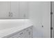 Pantry with white cabinets, drawers, counter space and white subway tile backsplash at 3624 N 59Th St, Mesa, AZ 85215