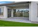 Covered patio with brick pavers and views of the desert landscaped backyard at 3624 N 59Th St, Mesa, AZ 85215