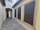 Exterior view of a charming patio with tiled flooring and door leading to the home's interior at 3624 N 59Th St, Mesa, AZ 85215