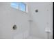 Modern walk-in shower with tiled walls, rainfall showerhead, and built-in niche for a luxurious bathing experience at 3624 N 59Th St, Mesa, AZ 85215