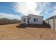 Home exterior with a large backyard, block wall and covered patio at 40000 W Bravo Dr, Maricopa, AZ 85138